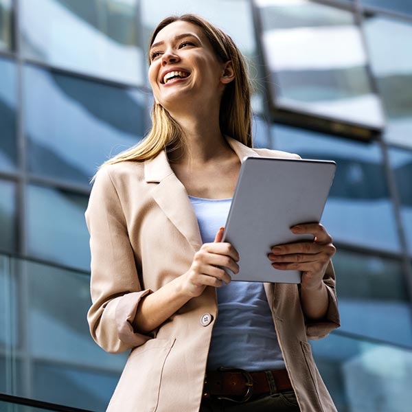 smiling professional woman outside an office building